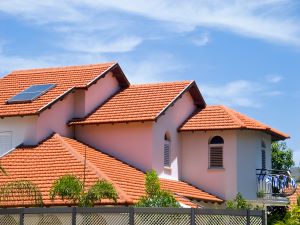 Big house or commercial property with a red tile roof