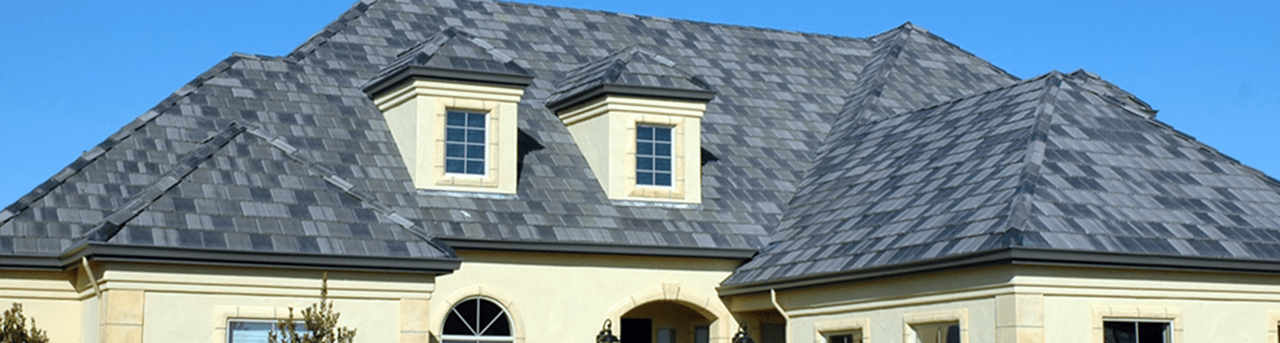 Residential House Grey Roofing With Attics Windows Infront and