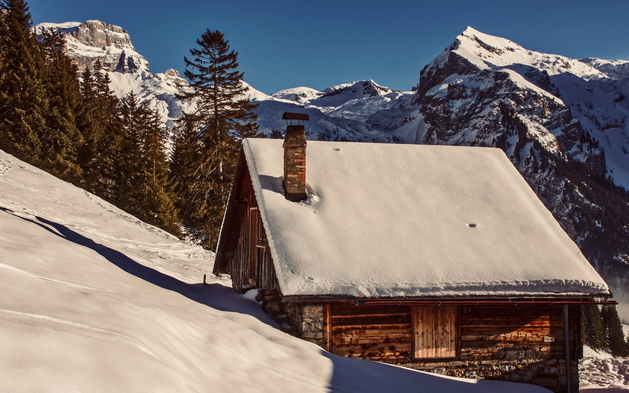 Image of roof with snows on it's roof and around it, Steep slope or low slope roof